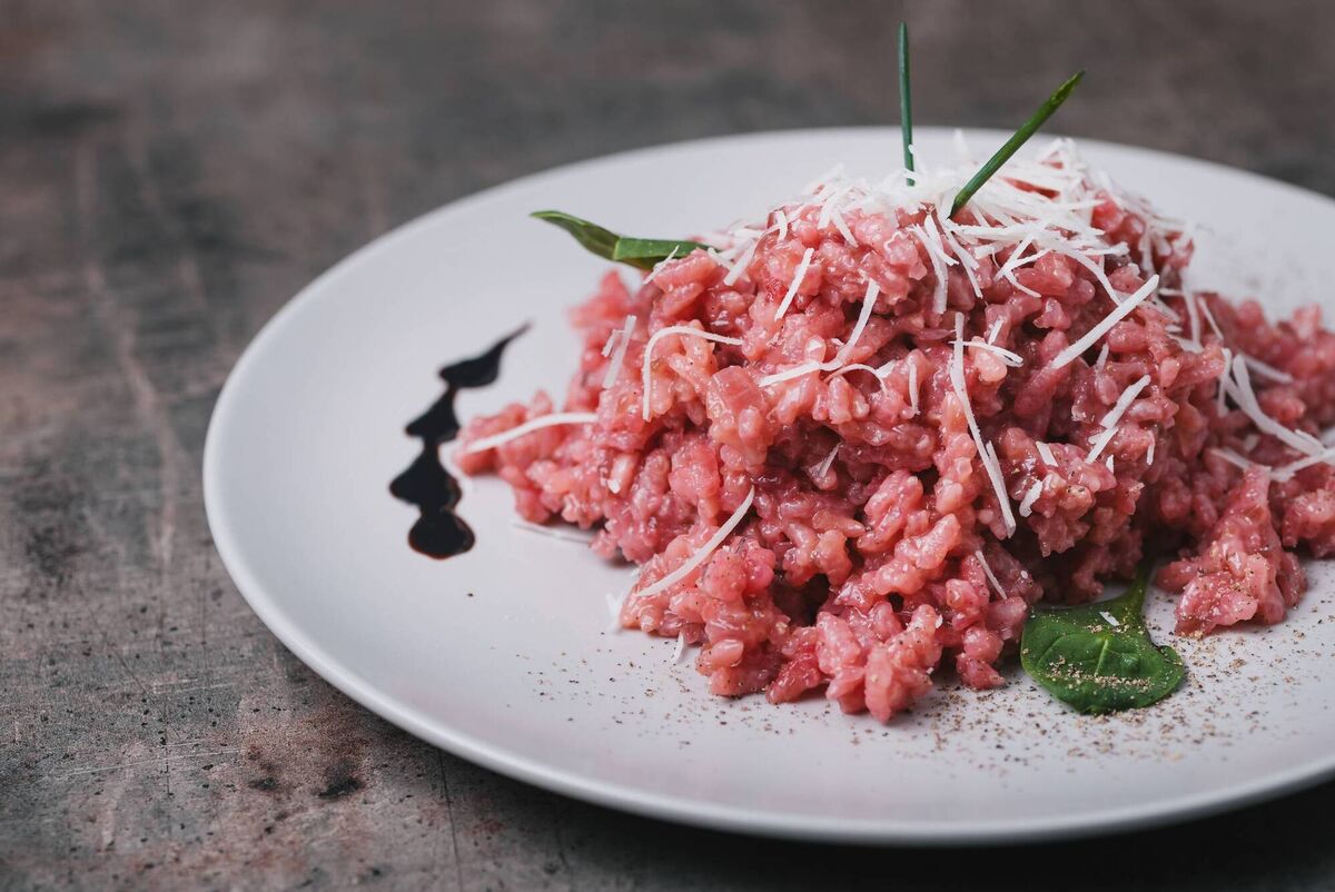 A plate of ruby red Amarone risotto, a Veronese classic A plate of ruby red Amarone risotto, a Veronese classic