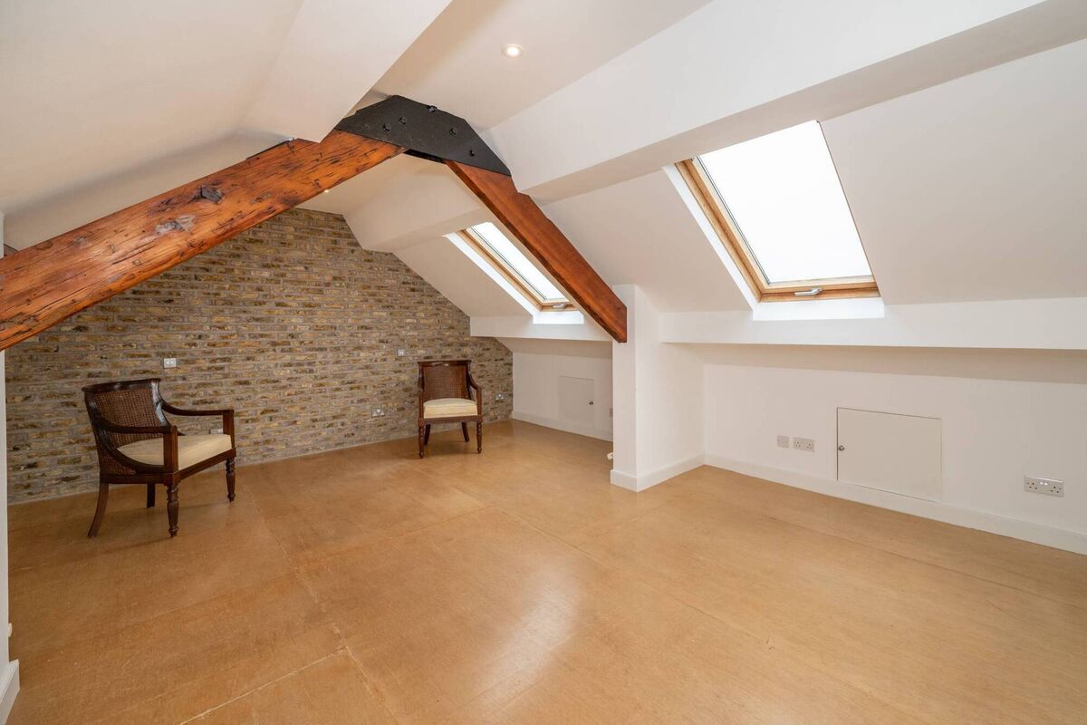 Exposed yellow brick in the double en suite bedroom under the eaves Exposed yellow brick in the double en suite bedroom under the eaves