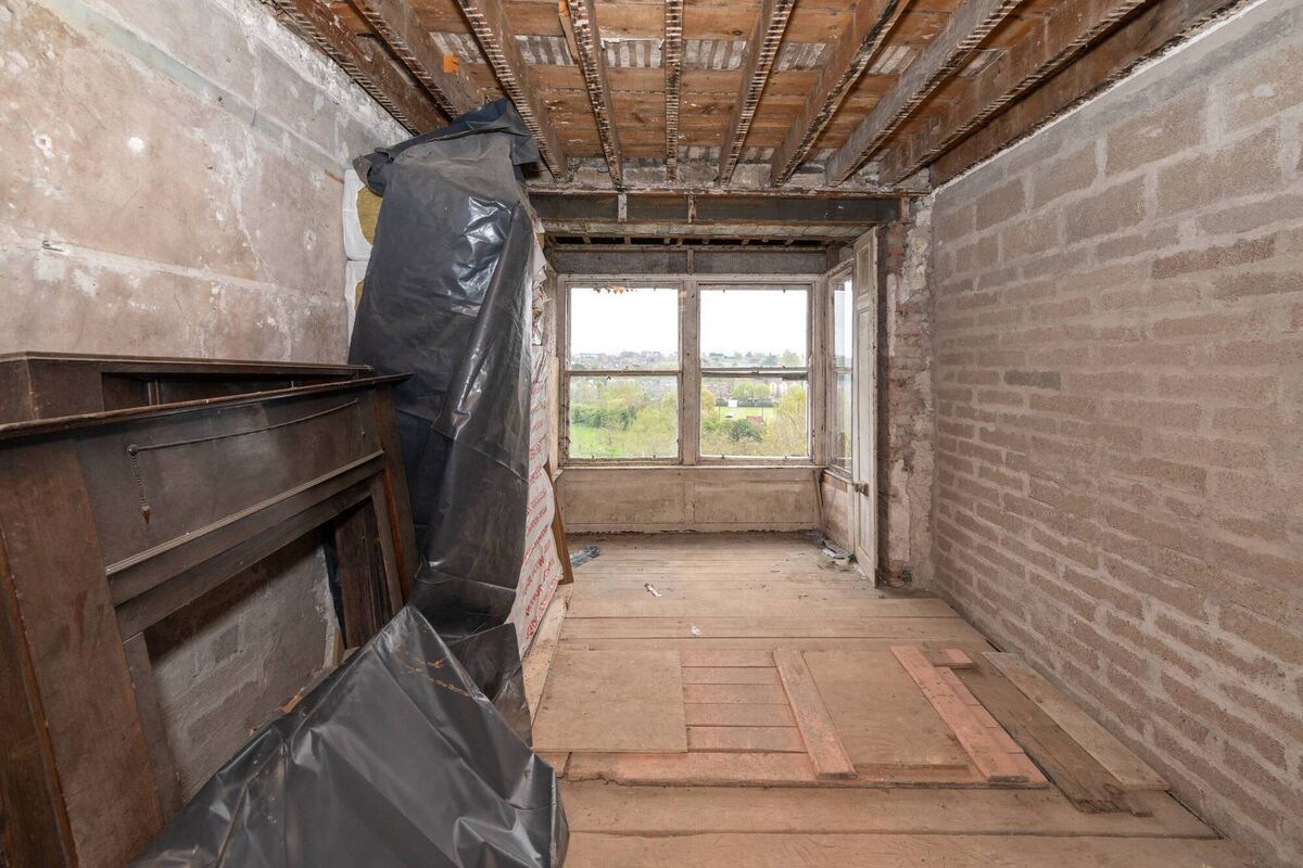Unfinished upper floor of the apartment with box bay window Unfinished upper floor of the apartment with box bay window