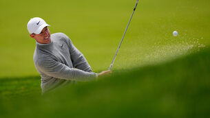 <p>Rory McIlroy hits onto the 13th green. Pic: AP Photo/Carolyn Kaster</p>