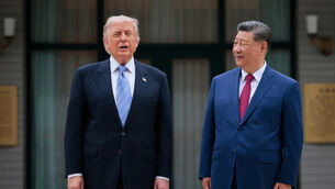 <p>US President Donald Trump, left, poses for a picture with Chinese President Xi Jinping (Evan Vucci/Pool via AP)</p>