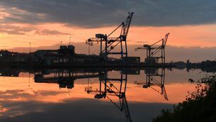 <p>Sunrise at Tivoli container terminal at the Port of Cork. The value of goods exports from Ireland tumbled more than 50% year on year in March 2026, figures released by the CSO on Friday show. Picture: Larry Cummins</p>