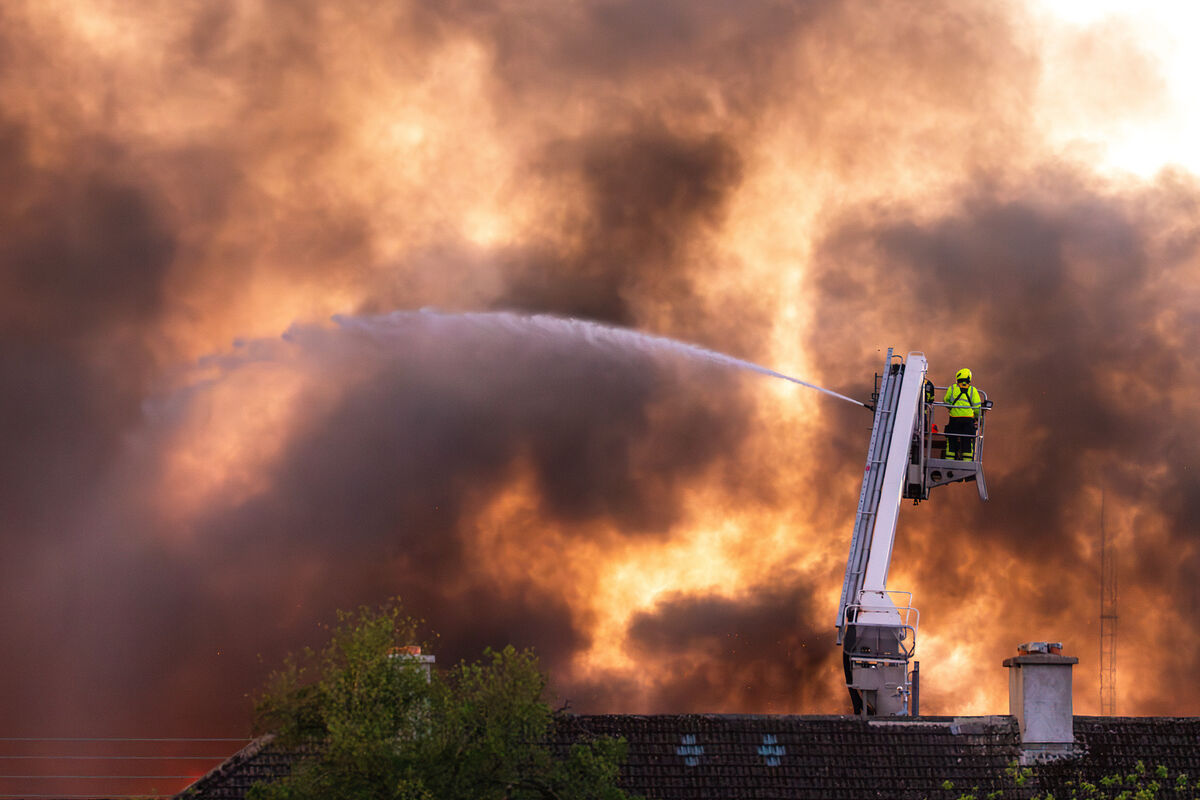Firefighters tackle the fire at the old Jute factory  in Tycor Business Centre. The fire was visible during the Cork vs Waterford Munster Senior Championship game at Walsh Park on Sunday. Picture: Noel Sweeney