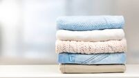 Stack of clothes empty copy space.