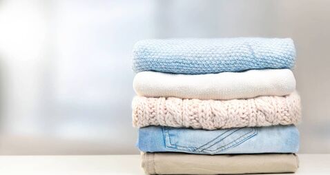 Stack of clothes empty copy space.