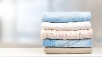 Stack of clothes empty copy space.