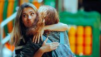 Woman Hugs Fake Friend Making Faces Behind her Back