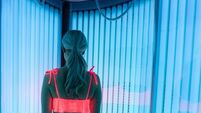 Woman tanning in a solarium at the spa