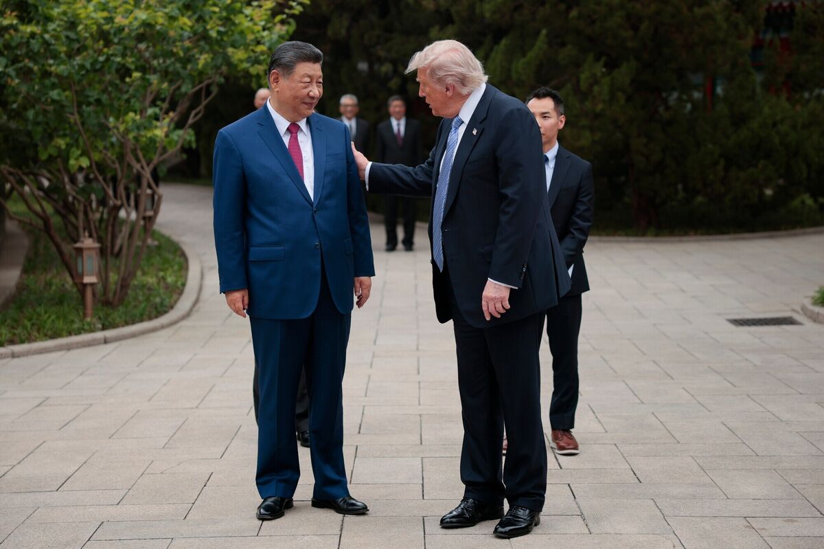 US president Donald Trump speaks with Chinese president Xi Jinping in Beijing on Friday. Picture: Evan Vucci/AP