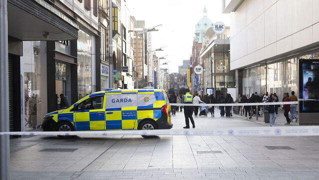 <p>
                <br>An Garda Síochána cordon off a section of Henry Street in front of Arnott’s on Friday evening. Picture: Sam Boal/Collins Photos</p>