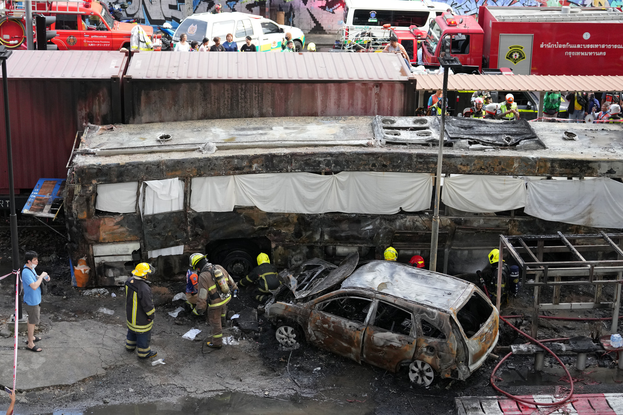 Deadly collision between train and bus in Thai capital