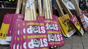 <p>Placards ahead of the pro-Palestine march in central London (Zhanna Manukyan/PA)</p>