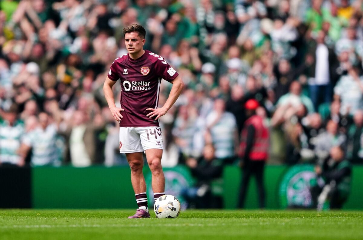 HEARTS BROKEN: Cameron Devlin stands dejected during the Premiership match at Celtic Park. Pic: Andrew Milligan/PA Wire