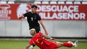 <p>HAT-TRICK HERO: The Republic of Ireland's Tom Cannon has a shot on goal despite the tackle of Kayden Harrack of Grenada. Pic: Stephen McCarthy/Sportsfile</p>