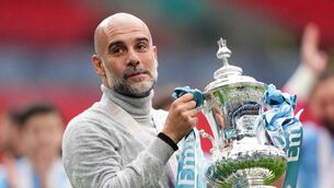 <p>SILVER SYMBOL: Manchester City manager Pep Guardiola celebrates with the FA Cup after Saturday's 1-0 win over Chelsea - but there's no time to have a celebratory beer, he says. Pic: John Walton/PA Wire.</p>