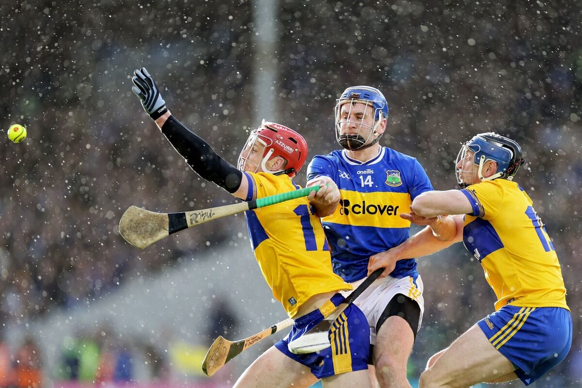 Clare's John Conlon and David McInerney with John McGrath. Pic: ©INPHO/Laszlo Geczo