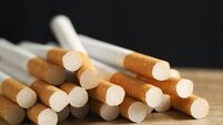image of several commercially made pile cigarette on black background. or Non smoking campaign concept, tobacco pattern top view