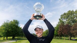 <p>BACK-TO-BACK CHAMP: Louise Landgraf with the Flogas Irish Women's Amateur Open Championship trophy. Pic: ©INPHO/Tom Maher</p>