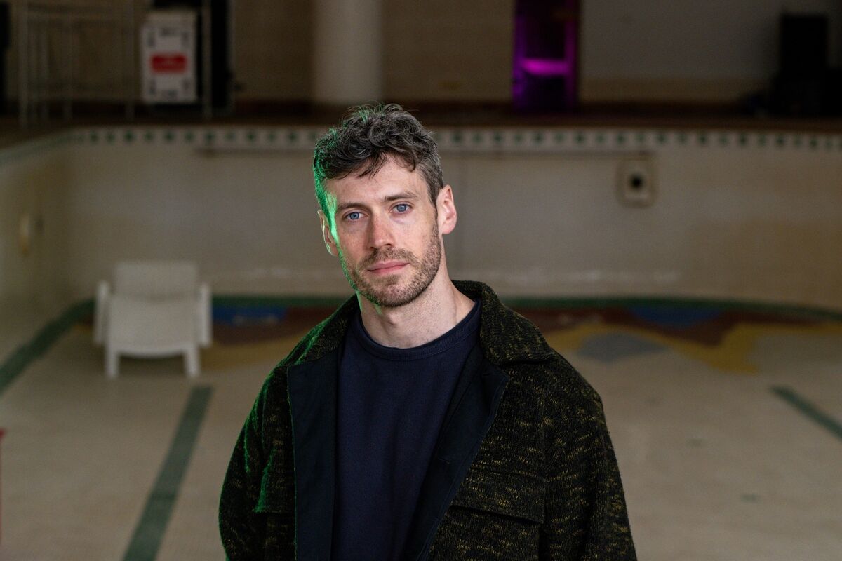 Luke Murphy at the empty pool in the Metropole Hotel. Picture: Chani Anderson