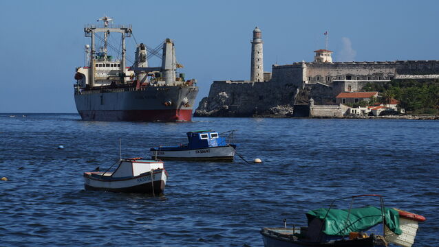 A cargo ship, top left, arrives in Havana Bay, Cuba, on Monday (Ramon Espinosa/AP)