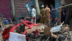 <p>Local residents examine damage at the site of a bomb explosion at a market in Sarai Norag in Lakki Marwat, a district in Pakistan's Khyber Pakhtunkhwa province. (AP Photo/Farhat Ullah)</p> <p>Local residents examine damage at the site of a bomb explosion at a market in Sarai Norag in Lakki Marwat, a district in Pakistan's Khyber Pakhtunkhwa province. (AP Photo/Farhat Ullah)</p>