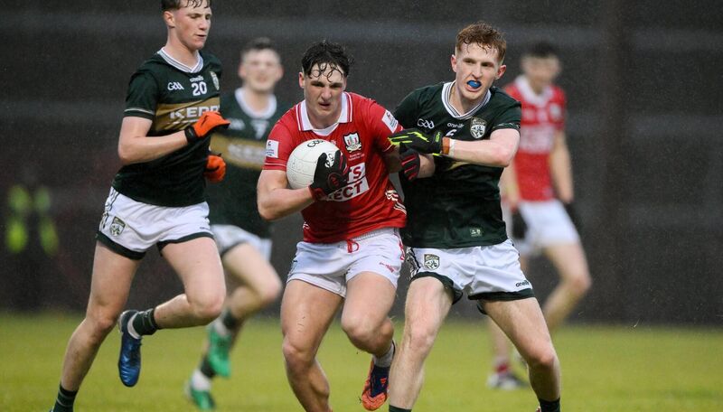 BATTLING: Cork's Tom Whooley braces for the challenge of Kerry centre back Cian Stack in the Munster MFC final at Páirc Uí Rinn. Pic: Brendan Moran/Sportsfile BATTLING: Cork's Tom Whooley braces for the challenge of Kerry centre back Cian Stack in the Munster MFC final at Páirc Uí Rinn. Pic: Brendan Moran/Sportsfile