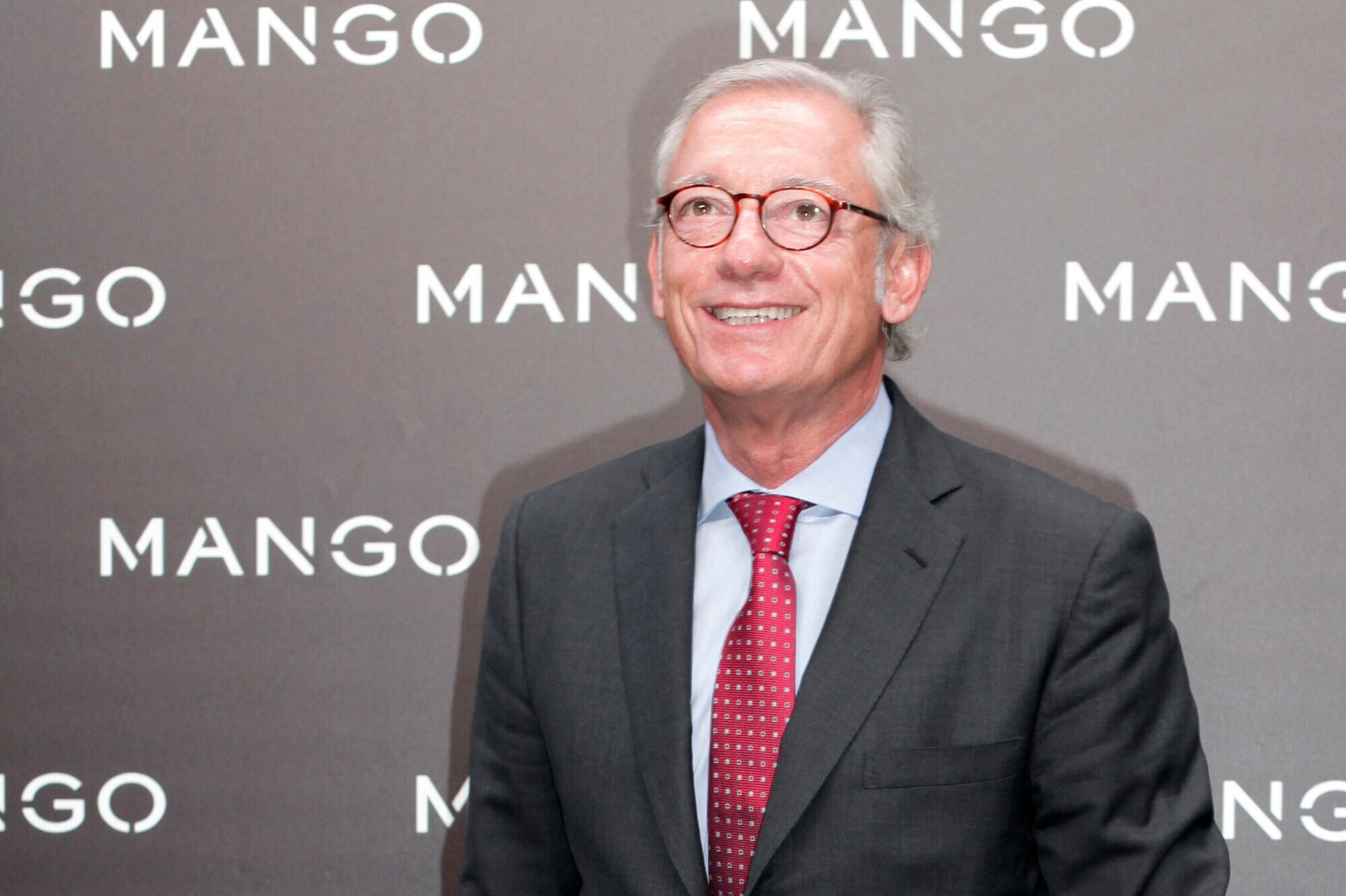 Son arrested on suspicion of involvement in death of Mango founder