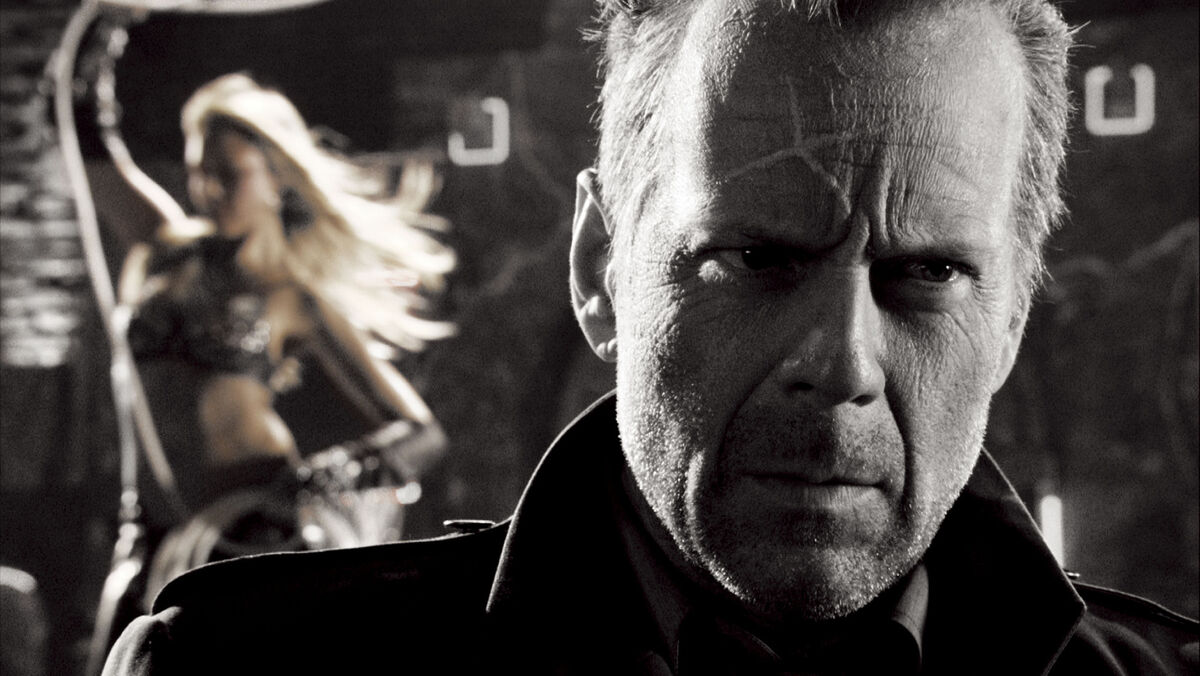 Jessica Alba and Bruce Willis in a scene from Sin City. Jessica Alba and Bruce Willis in a scene from Sin City.