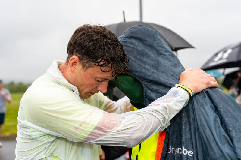 Jordan Adams of the FTD Brothers Foundations was greeted by his father, Glenn, as he finished the Cork marathon in the heavy rain. Picture: Noel Sweeney Jordan Adams of the FTD Brothers Foundations was greeted by his father, Glenn, as he finished the Cork marathon in the heavy rain. Picture: Noel Sweeney