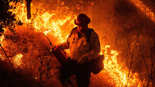 Crews conduct a firing operation to control the Sandy Fire (Ethan Swope/AP) Crews conduct a firing operation to control the Sandy Fire (Ethan Swope/AP)