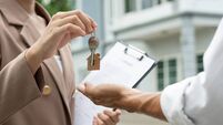 lease, rental and selling home. Real estate agent manager smile holding key for new owner. rent house, Sales, loan credit financ