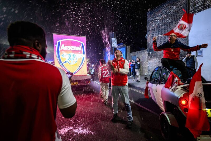 Fans celebrate outside Emirates Stadium  (Photo by Leon Neal/Getty Images)