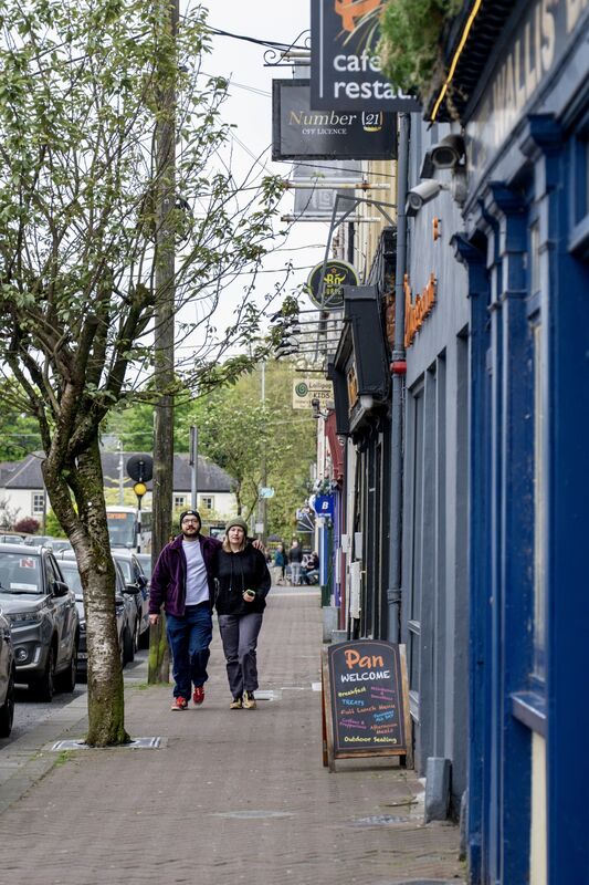 People walk along Main Street in Midleton, capturing the energy of the bustling town centre, where a strong mix of retail, hospitality and local services continues to drive its appeal. Picture Chani Anderson People walk along Main Street in Midleton, capturing the energy of the bustling town centre, where a strong mix of retail, hospitality and local services continues to drive its appeal. Picture Chani Anderson