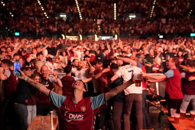 Aston Villa fans celebrate their side's third goal of the game. Pic: Joe Giddens/PA Wire. Aston Villa fans celebrate their side's third goal of the game. Pic: Joe Giddens/PA Wire.