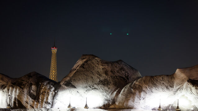The inflation of the artwork on the Pont Neuf bridge, with the Eiffel Tower behind it (Thomas Padilla/AP)