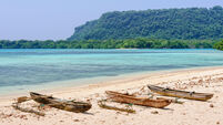 Outrigger canoes in the bay at Port Olry - Espititu Santo, Vanuatu