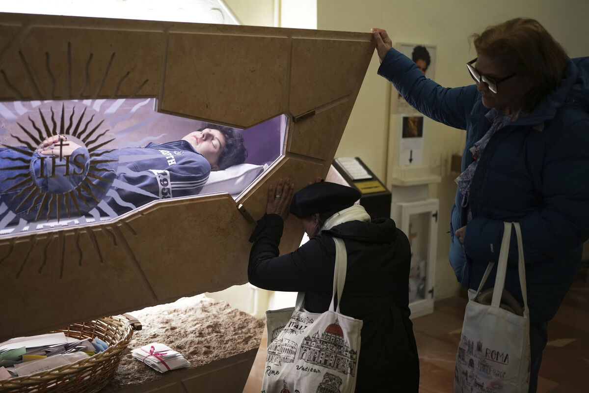 People pray in front of the body of Carlo Acutis in  the Santa Maria Maggiore church in Assisi, Italy,  in April 2025. File picture: Alessandra Tarantino/AP