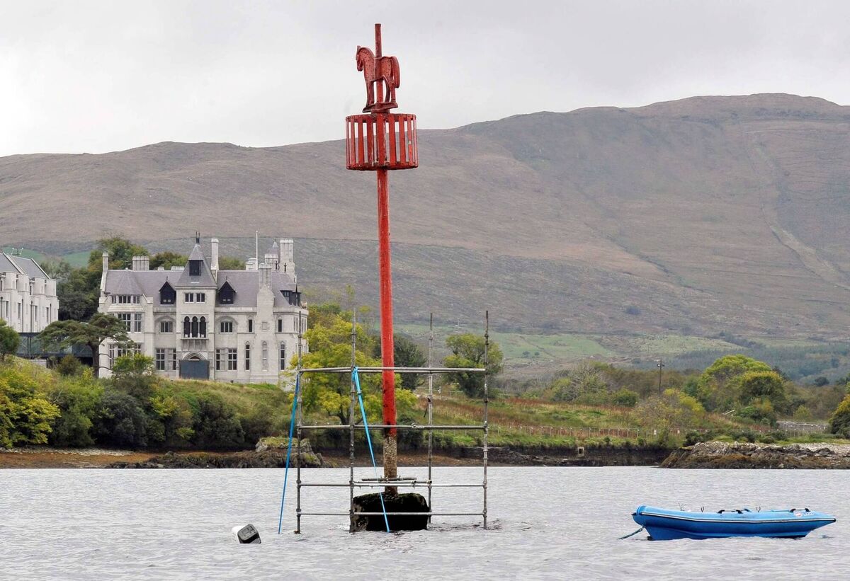 The Colt Rock with scaffolding around it in Castletownbere Harbour in 2009. In the backround is Dunboy Castle. Picture Denis Minihane.