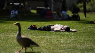 <p>A person enjoys the warm weather in St James's Park in London on Friday. Picture: Jordan Pettitt/PA</p>