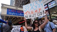 Anti-Trump protesters rally outside CBS Late Show Studio over Colbert Firing