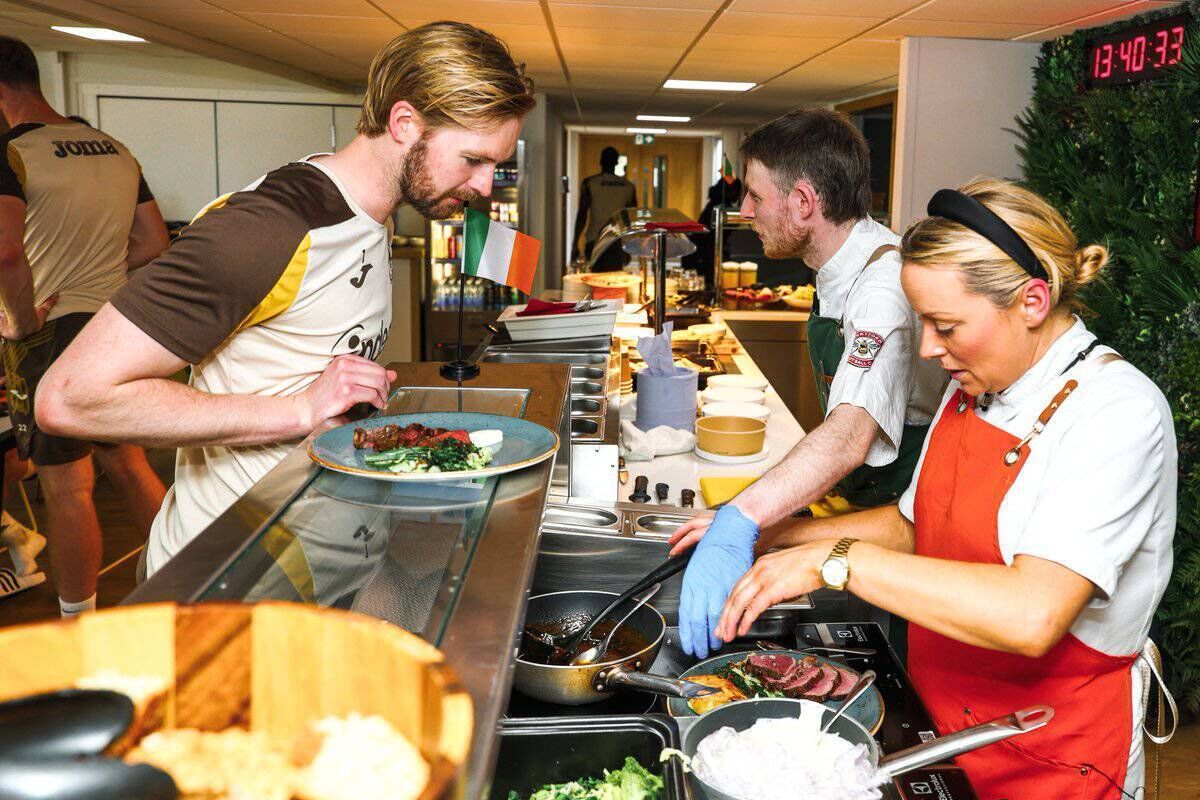 IRISH STEW: Caoimhin Kelleher samples the fare on offer when renowned Irish chef Anna Haugh visited Brentford's training ground at the request of manager Keith Andrews.