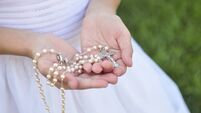 Rosary in Girl's hands