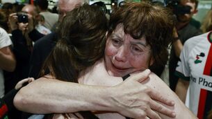 <p>Dr Margaret Connolly (right) embraces her daughter, Katie, at Dublin Airport as fifteen Irish citizens who were detained by Israel arrive back in Ireland. Picture: Conor O Mearain/PA Wire</p>