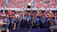 Cameron Woki celebrates with the Champions Cup Trophy and teammates after the match 23/5/2026