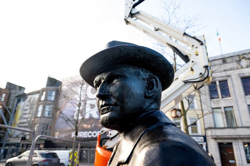 The sculpture of Michael Collins with the current Cork City Library headquarters in the background. Picture Chani Anderson The sculpture of Michael Collins with the current Cork City Library headquarters in the background. Picture Chani Anderson