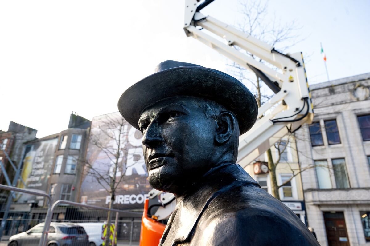 The sculpture of Michael Collins with the current Cork City Library headquarters in the background. Picture Chani Anderson
