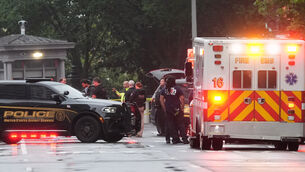 US Secret Service Police and District of Columbia Emergency Medical Services are seen on a crime scene after responding to reports of shots fired near the White House (Alex Brandon/AP)