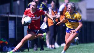 <p>Cork's Rose Murphy tries to evade Abi Kelly of Clare in the Munster Senior B final. Picture: Brendan Gleeson</p>