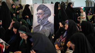 Women gather around a portrait of Iran’s Supreme Leader, Ayatollah Mojtaba Khamenei, during a ceremony honoring the armed forces and those killed in the war with Israel and the US at the Imam Khomeini Grand Mosque in Tehran, Iran (Vahid Salemi/AP) Women gather around a portrait of Iran’s Supreme Leader, Ayatollah Mojtaba Khamenei, during a ceremony honoring the armed forces and those killed in the war with Israel and the US at the Imam Khomeini Grand Mosque in Tehran, Iran (Vahid Salemi/AP)