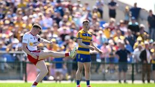 <p>Ethan Jordan of Tyrone kicks the winning point. Pic: Paul Phelan/Sportsfile</p>